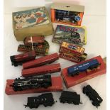 A box of assorted vintage toys, games and trains.
