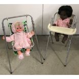 A vintage metal framed dolls high chair and swing chair. Together with 2 vintage vinyl dolls.