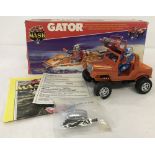 A boxed 1985 Kenner Parker Toys "Mask" Gator toy.