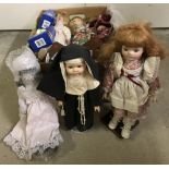 A box of 14 assorted porcelain collectors dolls, to include 2 boxed, and a quantity of stands.