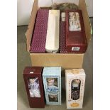 A quantity of 11 boxed (as new) porcelain collectors dolls.