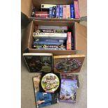 A large quantity in 2 boxes of vintage and modern children's and adult jigsaw puzzles.