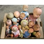 A quantity of vintage hard plastic and celluloid dolls.