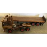 A large scratch built wooden Scania 142e Truck with flatbed trailer.