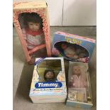 4 boxed vintage dolls.