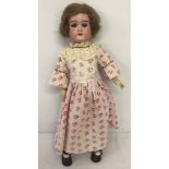 An antique Armand Marseille 20 inch ' Floradora' bisque head doll.