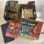 A collection of vintage games and children's books.