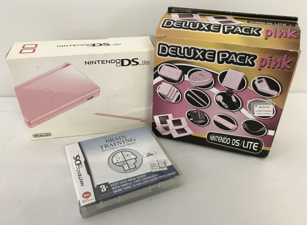 A boxed pink Nintendo DS Lite with Deluxe Accessories Pack & 1 game.