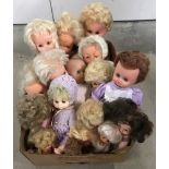 A box of mixed size vintage vinyl dolls.
