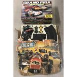 2 vintage Scalextric sets to include 5 cars.