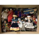 A large collection of porcelain collectors dolls in National costume.