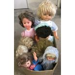 A box of vintage vinyl and plastic large/medium dolls.