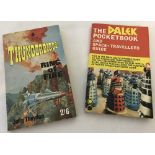 A 1965 Dalek Pocketbook together with a 1966 Thunderbirds paperback book.