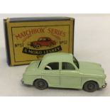 A boxed Matchbox #57 Wolseley 1500 in pale green.
