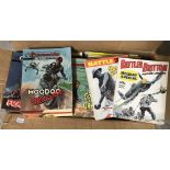 A box of vintage Pocket War Library, Commando and Battle comic books.