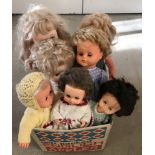 A box of 7 vintage vinyl dolls.