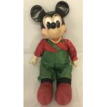 A vintage Mickey Mouse toy with soft body and vinyl hands and head.