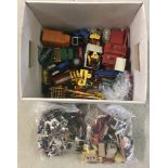 A box of assorted Britains farm tractors, machinery and plastic farm animals and accessories.