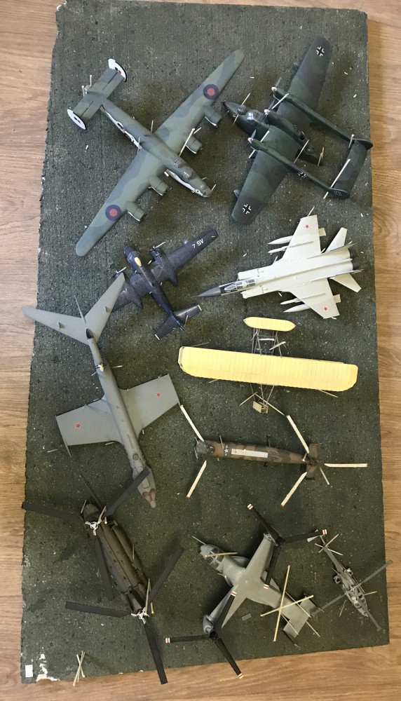 10 assembled and painted kit military aeroplanes to include a bi-plane.