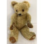 A c1940's Merrythought teddy bear.