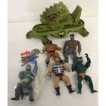 A box of assorted 1980's Mattel Masters of the Universe action figures and playset.