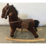A modern soft toy rocking horse with sound effects.