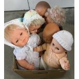 A box of 6 soft body and vinyl dolls.