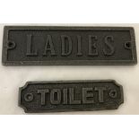 2 cast metal signs "Ladies" and "Toilet".