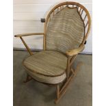 A mid century Ercol elm Windsor Grandfather rocking chair.