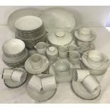 A large quantity of white with silver piping dinner and tea ware by Thomas, Germany.