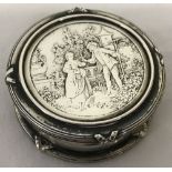 A continental 800 silver lidded trinket pot with classical scene to lid.