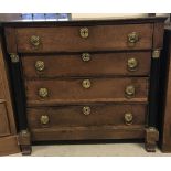 A Victorian 4 drawer dark wood chest with column detail to sides.