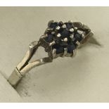 A 9ct gold sapphire cluster style dress ring.