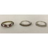3 silver stone set eternity style dress rings.