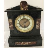 A vintage black slate and marble mantle clock.