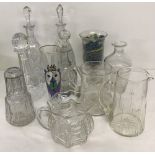 A mixed box of glass ware to include decanters and jugs.