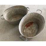 2 small oval galvanized tin baths.