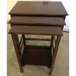 A nest of 3 mahogany inlaid tables with straight legs.