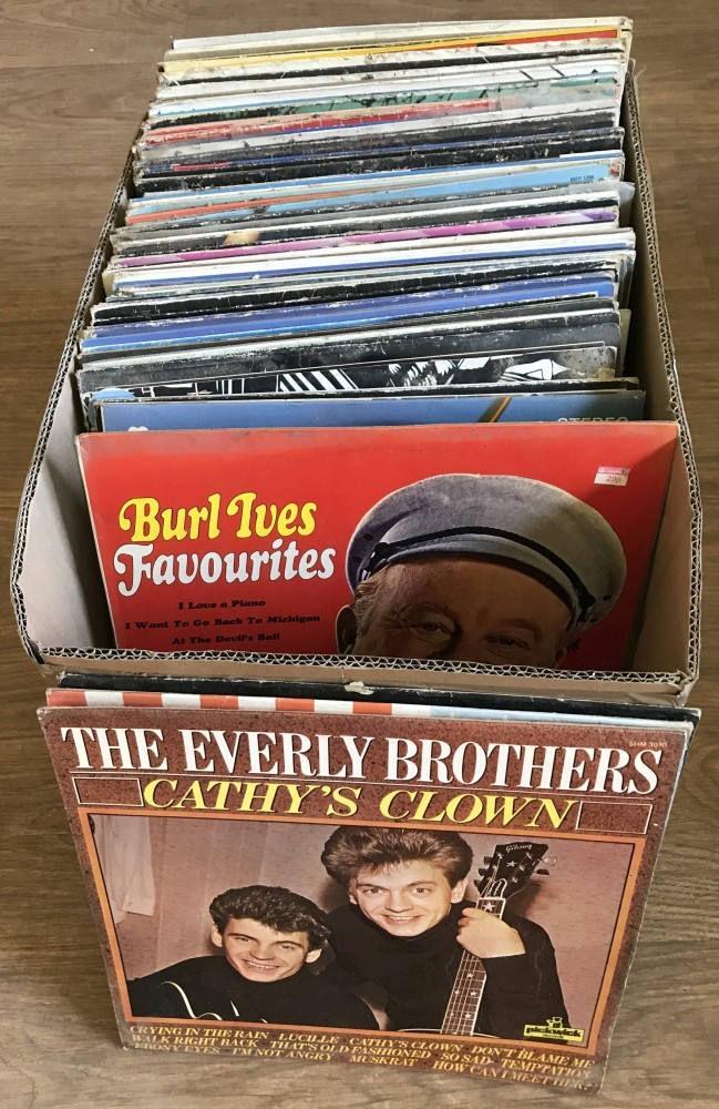 A box of mixed vintage music LP's.