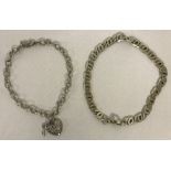 2 x silver chain bracelets.