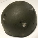 A Israeli helmet with bullet marks.