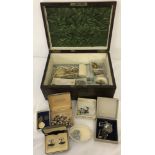 A wooden box containing a quantity of vintage jewellery.
