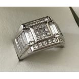 A men 925 silver ring. Square shaped, set with square and oblong cut clear stone.