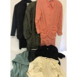 A quantity of designer vintage ladies tops, suits dresses and jackets.