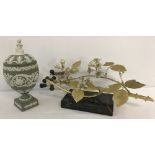A vintage china and gilt bronze ornament of a blackberry branch mounted on a marble base.