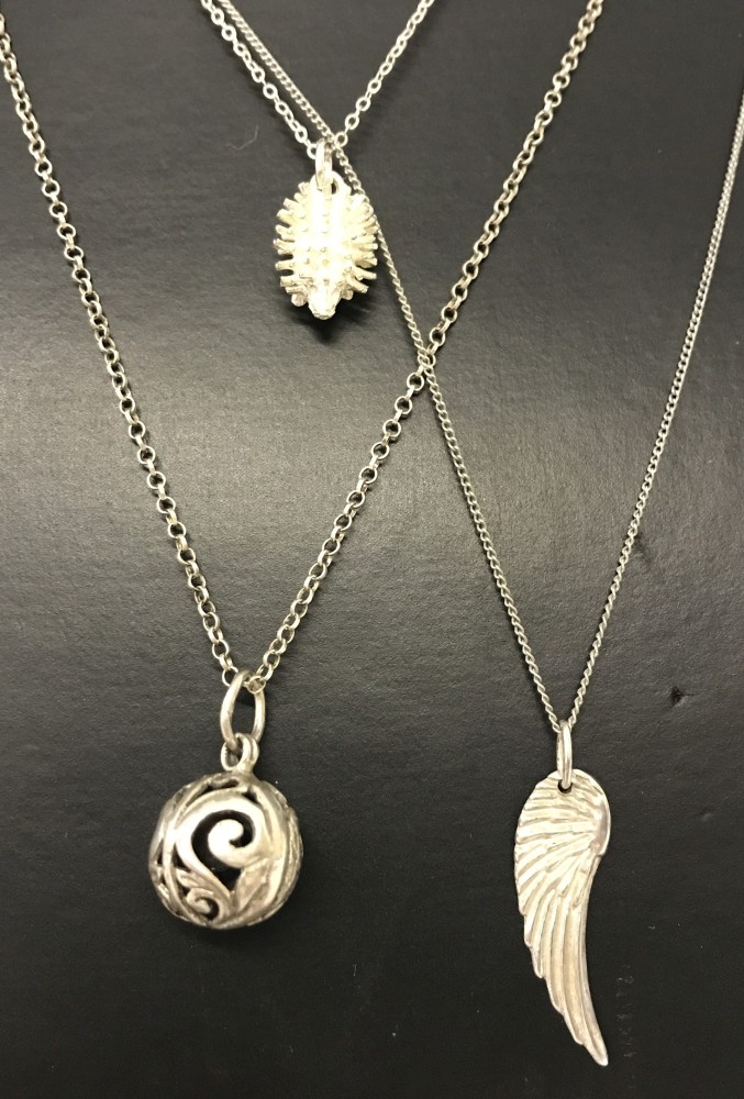 3 x pendants on silver chains.