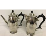 Matching vintage hallmarked silver coffee pot and water pot.