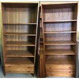 A pair of vintage teak shelving units Danish Made by Domino Mobler, with 2 drawers to base.