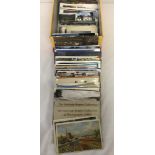 A box containing a fair quantity of vintage postcards.