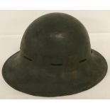 A military tin helmet with liner.